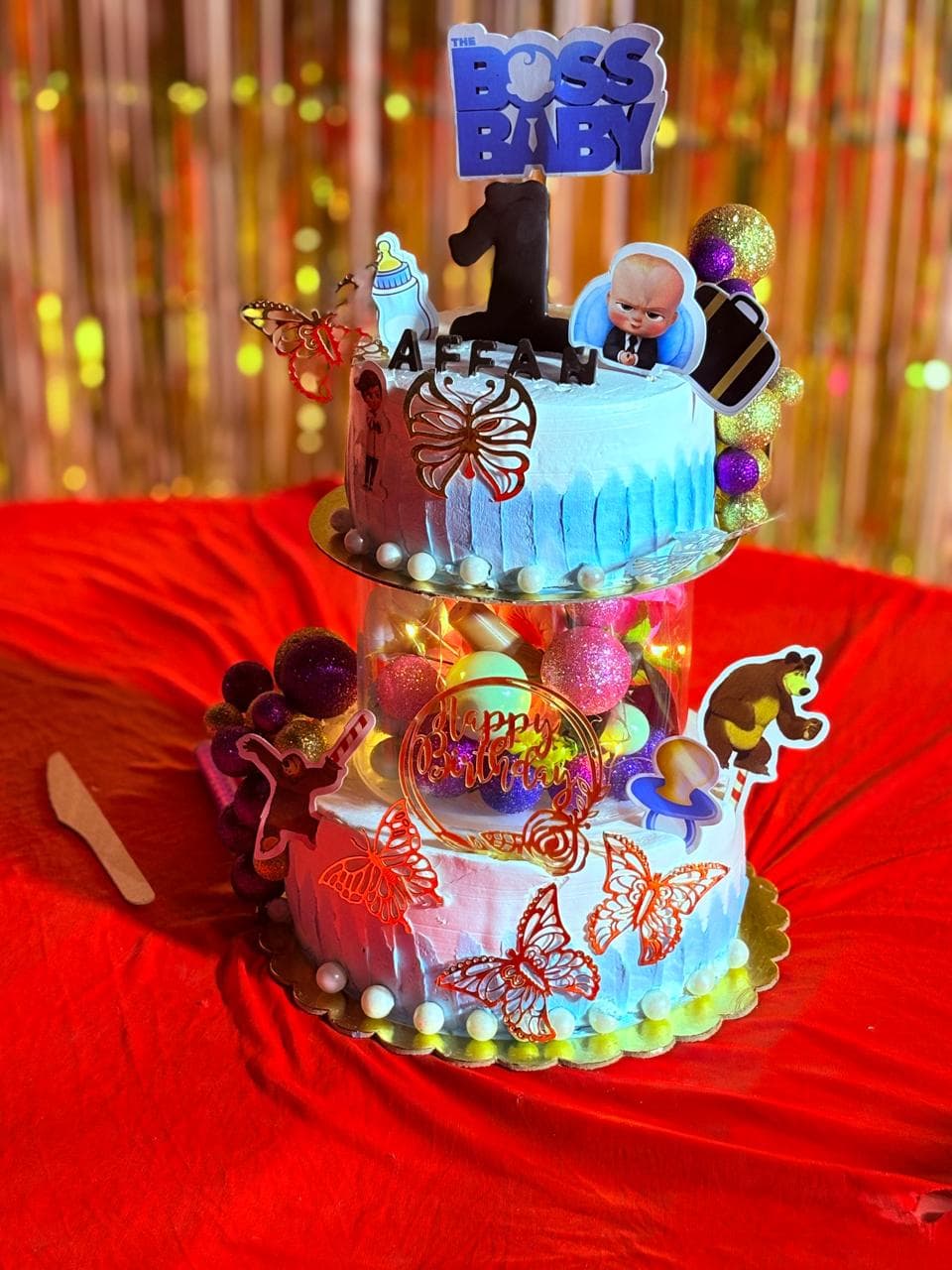 Two-tier birthday cake with colorful decorations