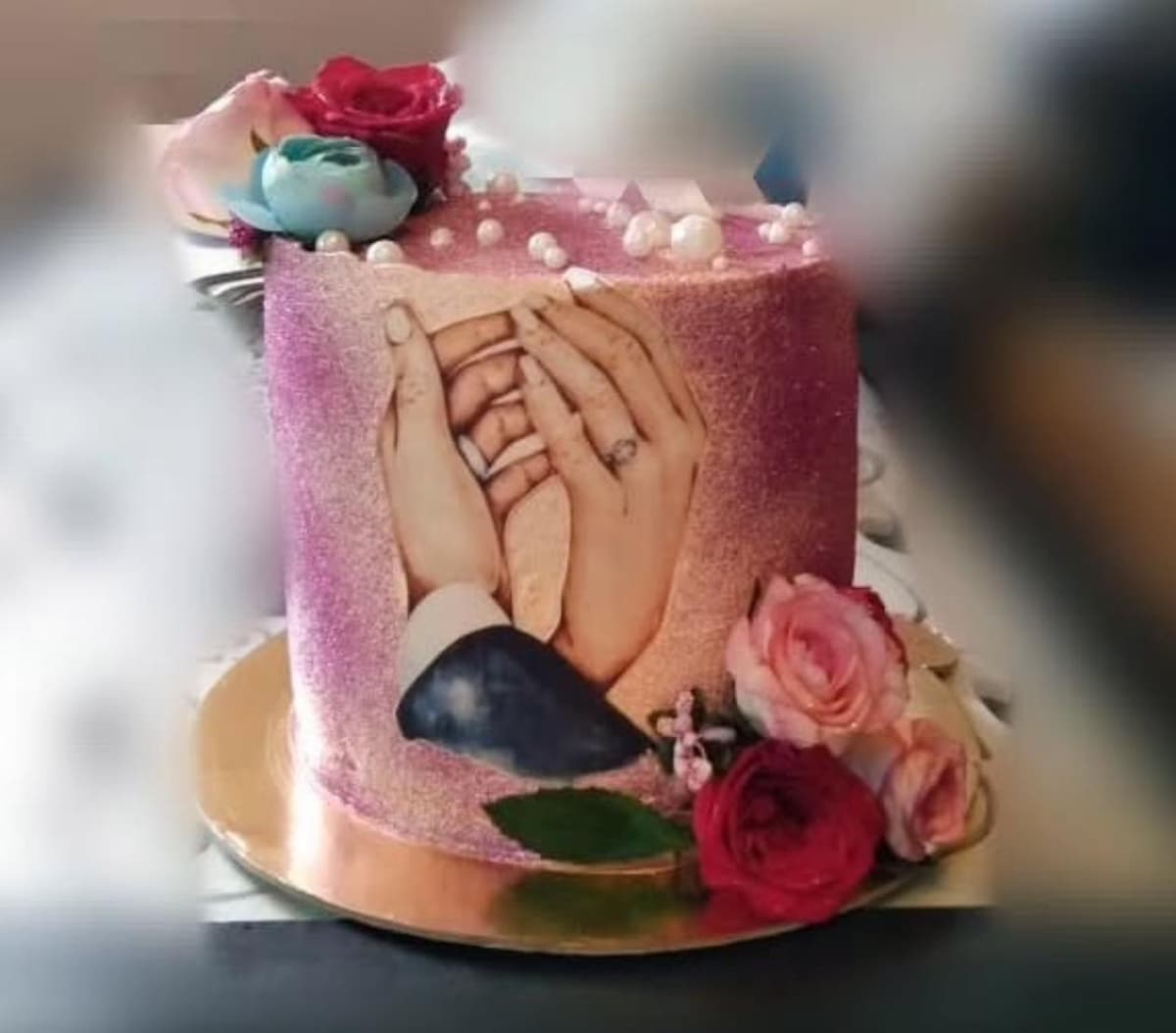 Elegant engagement cake with romantic decorations and flowers