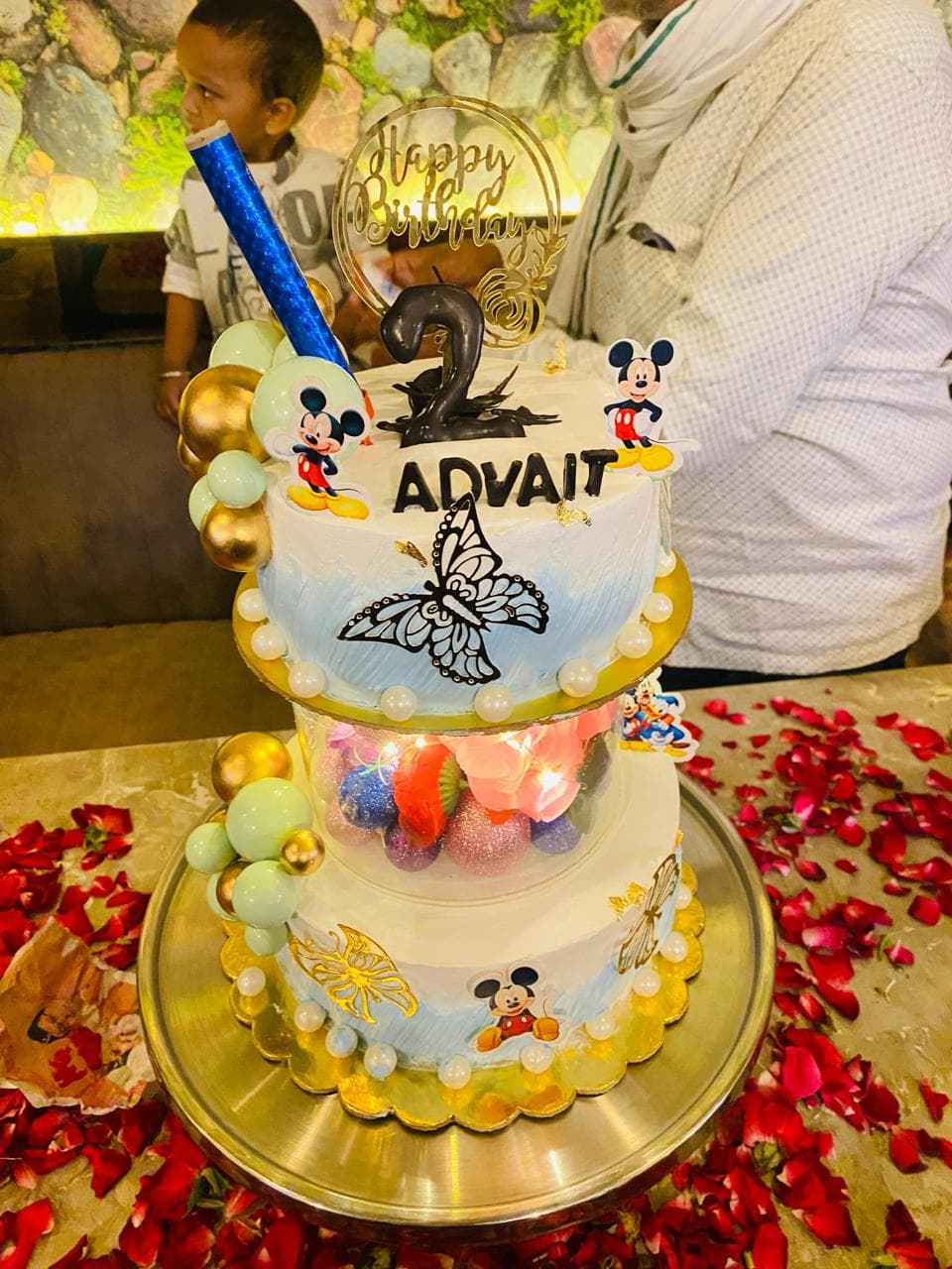 Beautiful two-tier birthday cake with elegant decorations