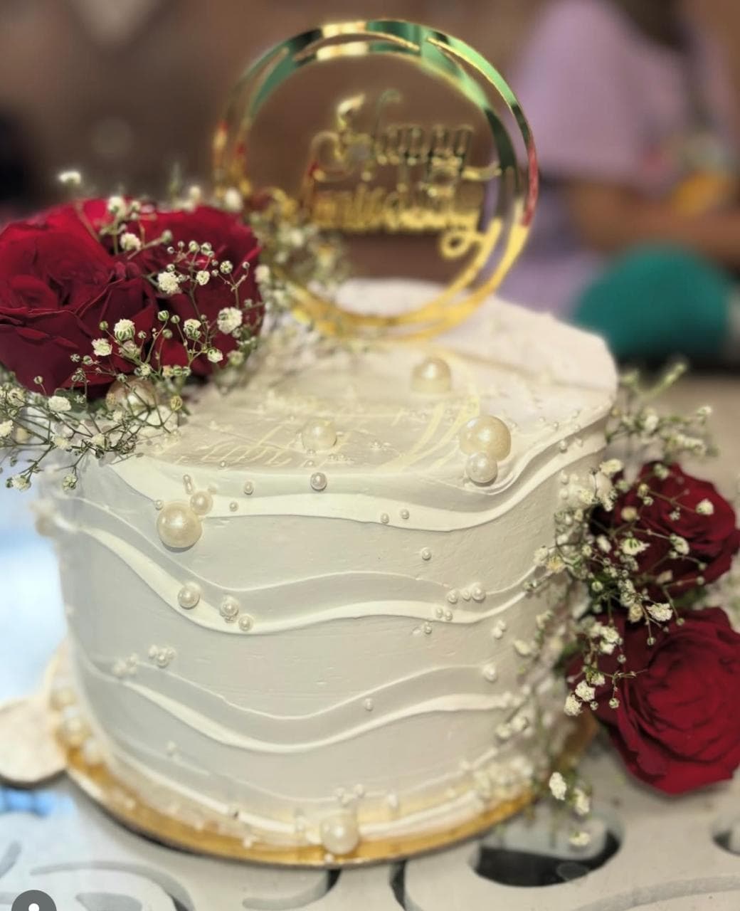 Elegant anniversary cake with romantic decorations